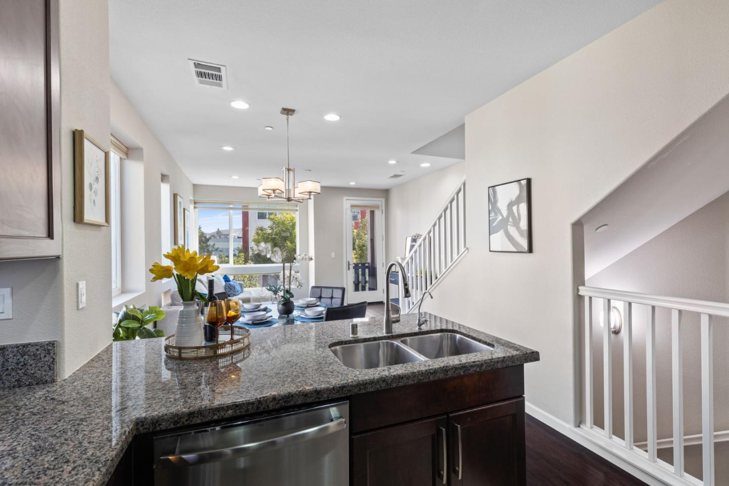 402 Ellicott Loop San Jose, CA 95123 - Photo 11 of 33 a kitchen with stainless steel appliances granite countertop a sink a counter space and a window
