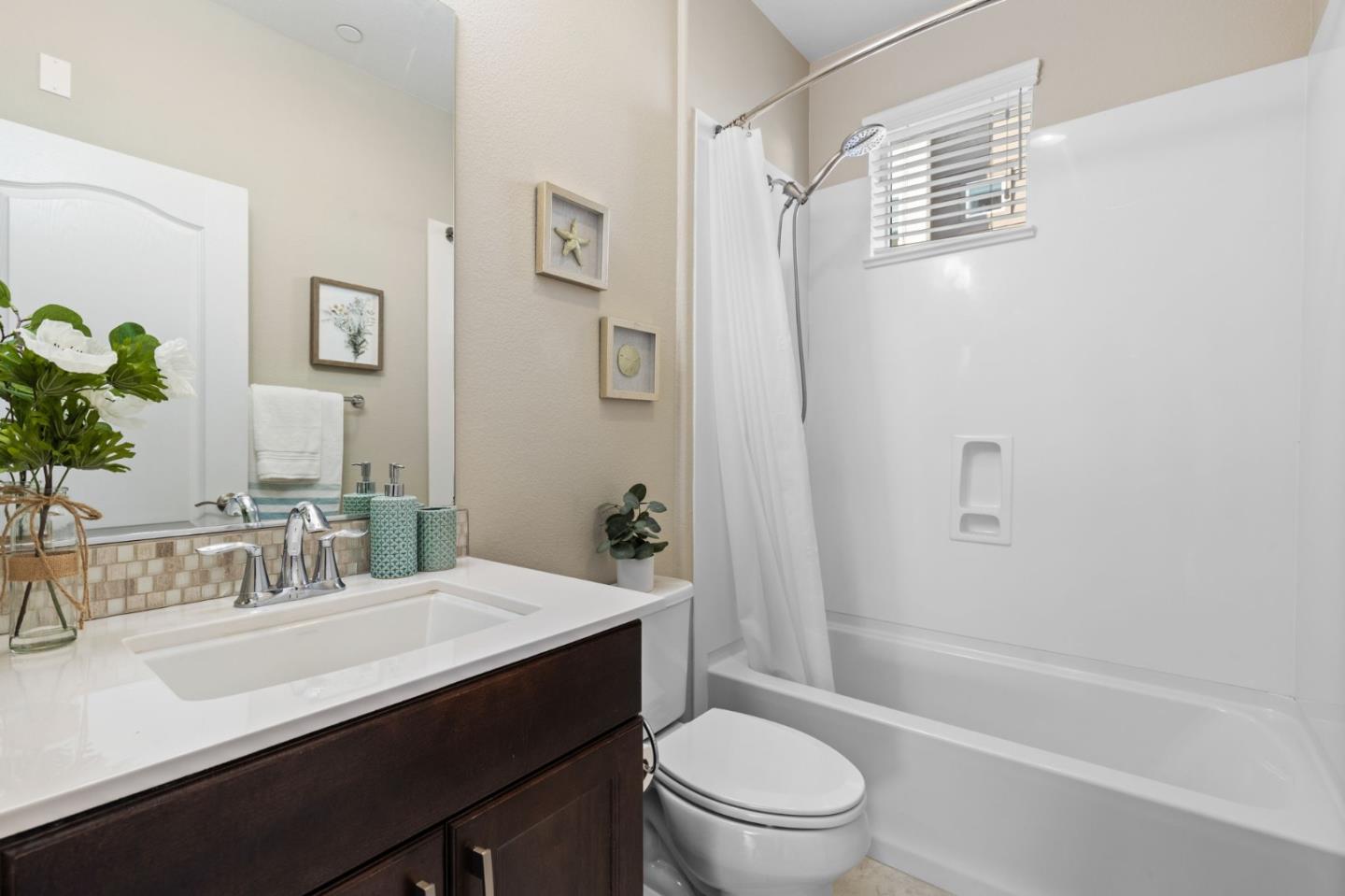 402 Ellicott Loop San Jose, CA 95123 - Photo 17 of 33 a bathroom with a sink a toilet and shower