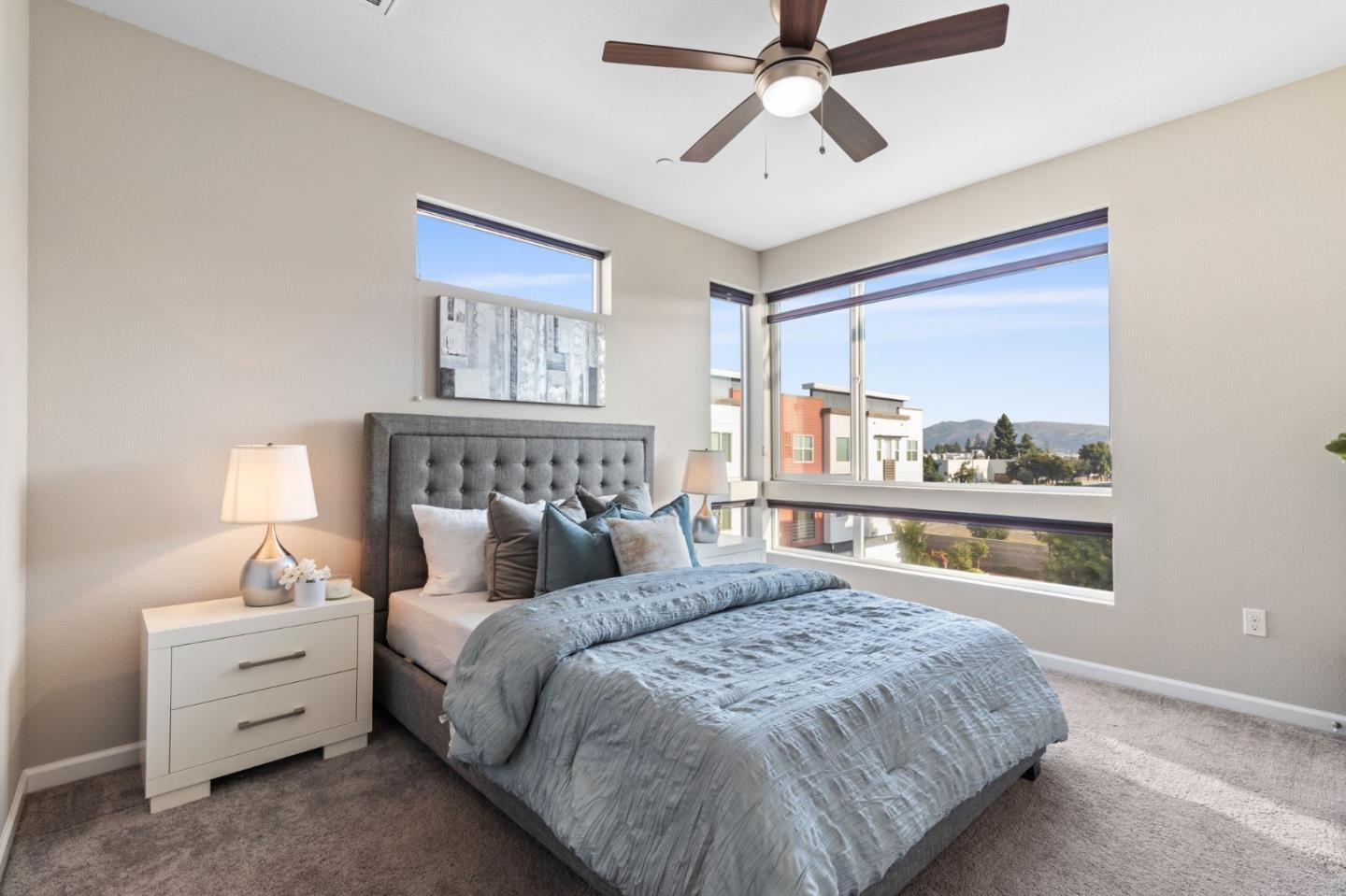 402 Ellicott Loop San Jose, CA 95123 - Photo 19 of 33 a bedroom with a large bed and a chandelier fan