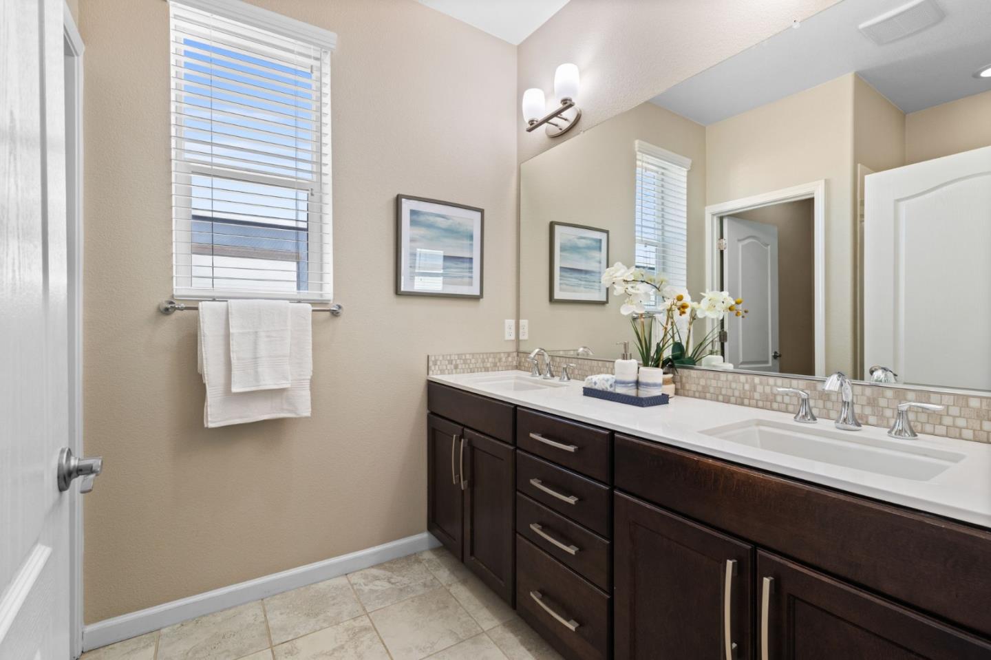 402 Ellicott Loop San Jose, CA 95123 - Photo 20 of 33 a bathroom with a double vanity sink and mirror