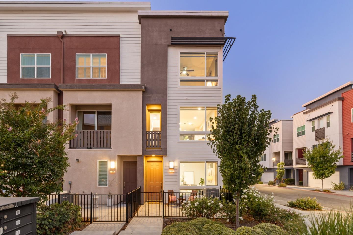 402 Ellicott Loop San Jose, CA 95123 - Photo 2 of 33 a front view of a house with a yard