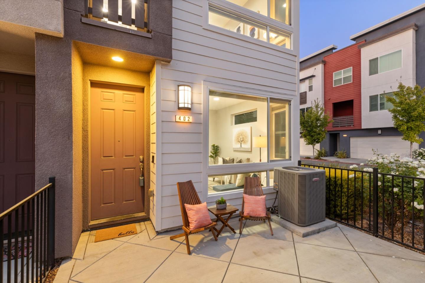 402 Ellicott Loop San Jose, CA 95123 - Photo 4 of 33 a view of a patio with table and chairs and wooden fence