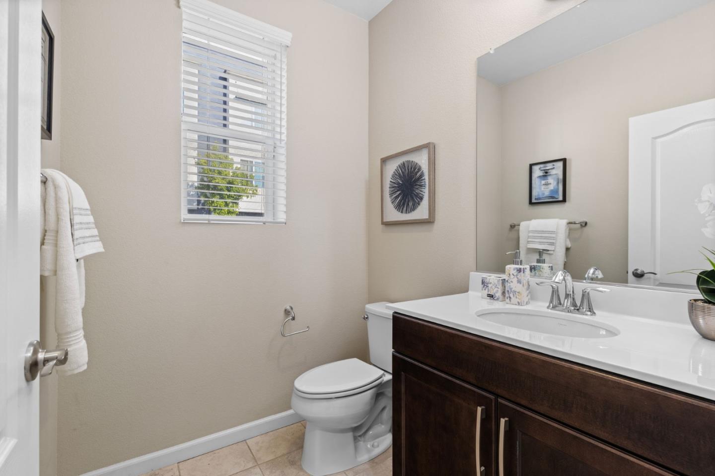 402 Ellicott Loop San Jose, CA 95123 - Photo 7 of 33 a bathroom with a sink and a toilet