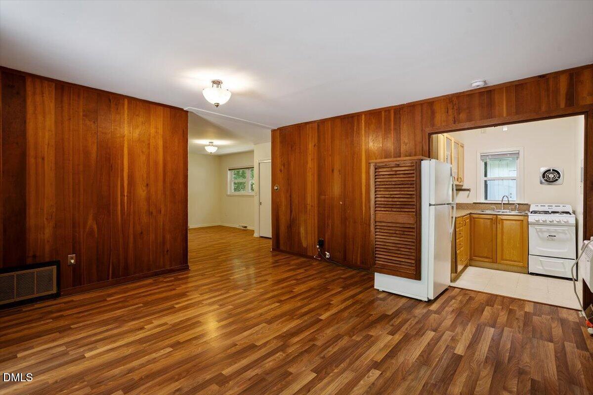 904 Kings Mill Road Chapel Hill, NC 27517 - Photo 23 of 33 a view of empty room with wooden floor