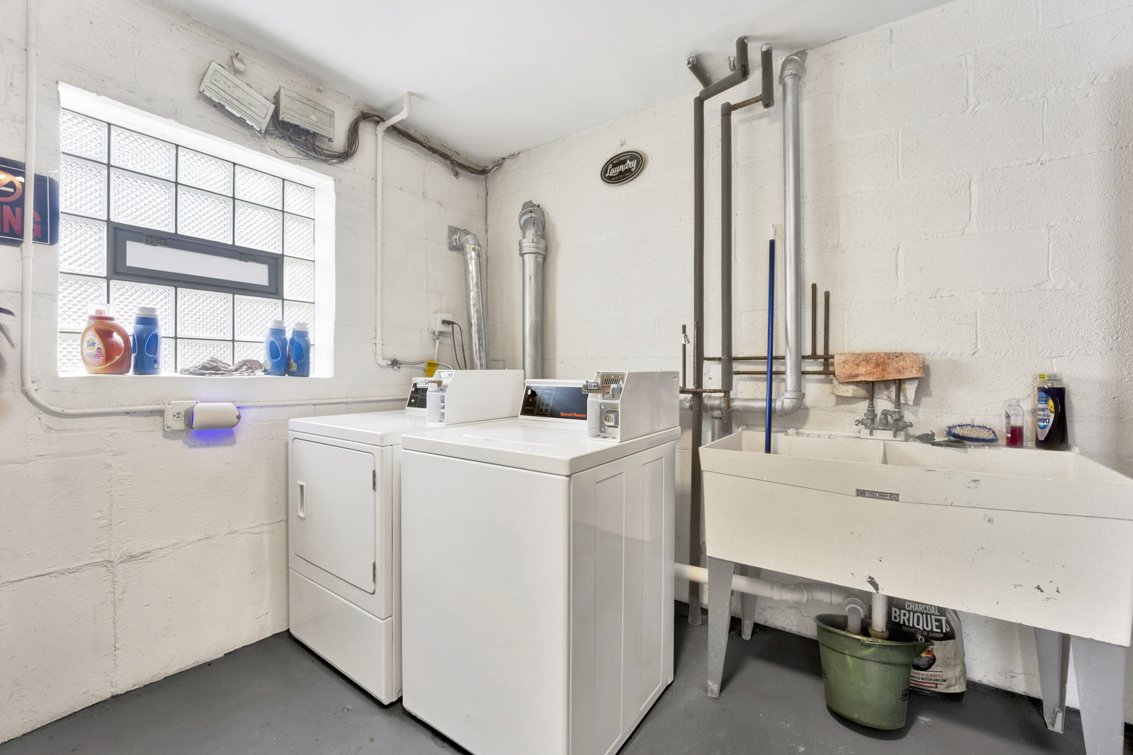 1608 Ogden Avenue, Unit 1E Downers Grove, IL 60515 - Photo 18 of 18 a room with sink dryer and washer