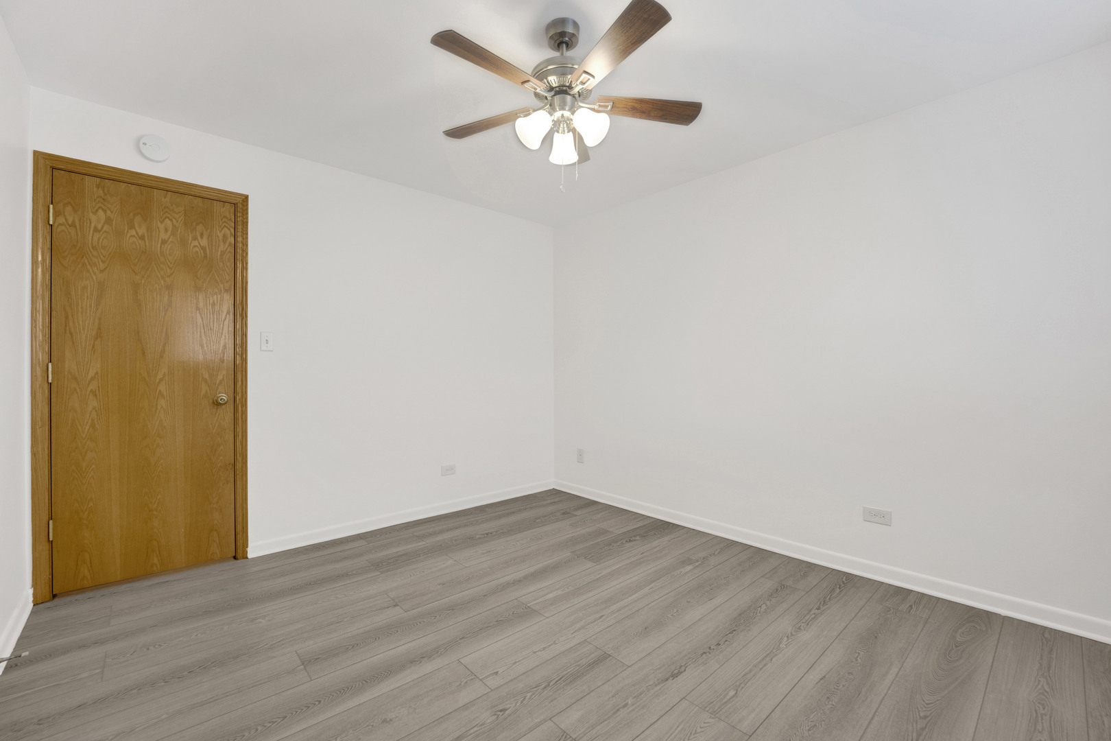 1608 Ogden Avenue, Unit 1E Downers Grove, IL 60515 - Photo 10 of 18 a view of an empty room with window