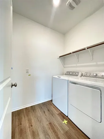 a view of a storage & utility room with washer and dryer
