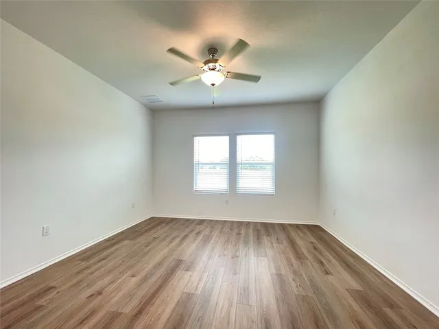 a spacious bathroom with a granite countertop tub sink and shower