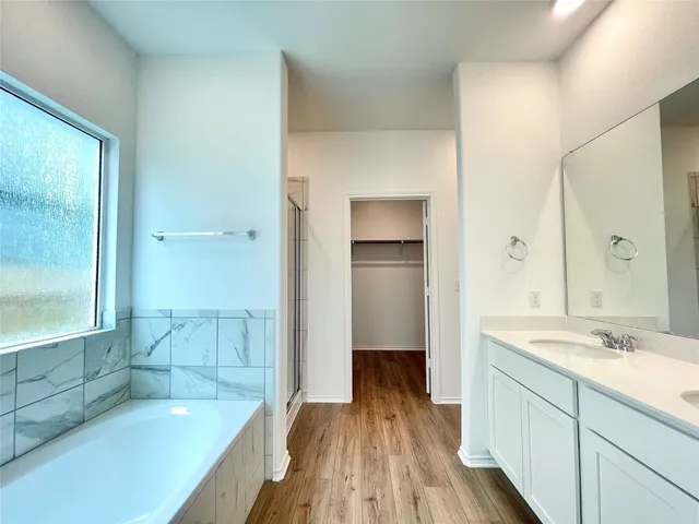 a bathroom with a bathtub and a shower