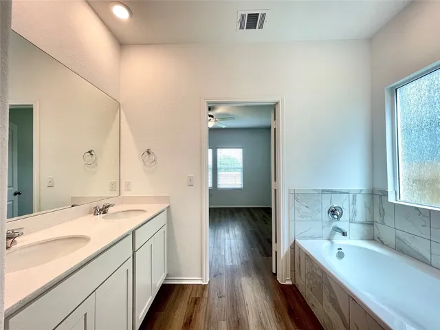 a view of hallway with wooden floor