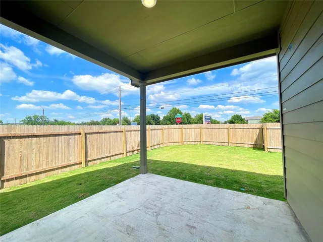 a view of a house with backyard and porch