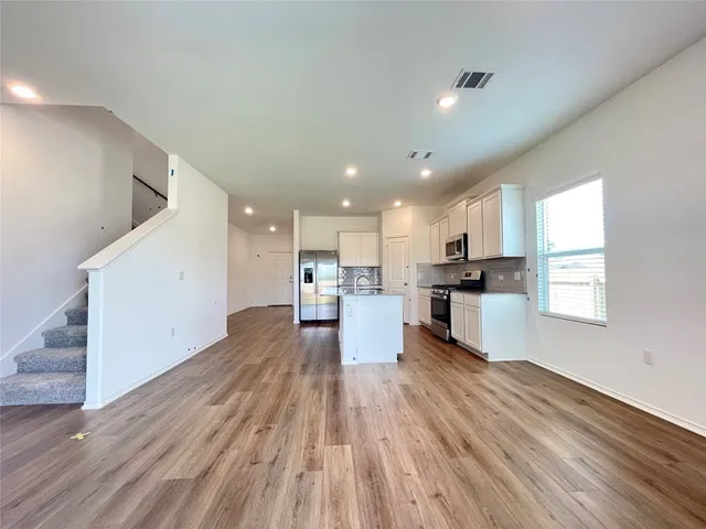 a view of kitchen with wooden floor