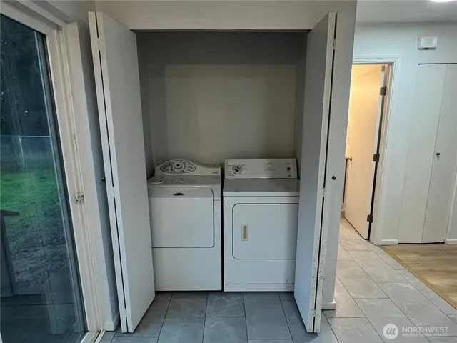 a bathroom with a granite countertop sink toilet and a mirror