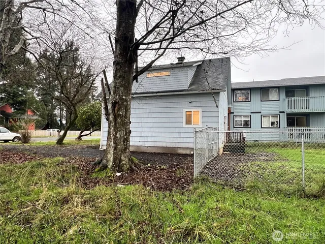a view of backyard with garden and deck