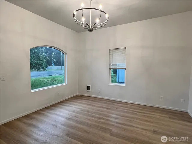 a view of a kitchen with a sink and a window