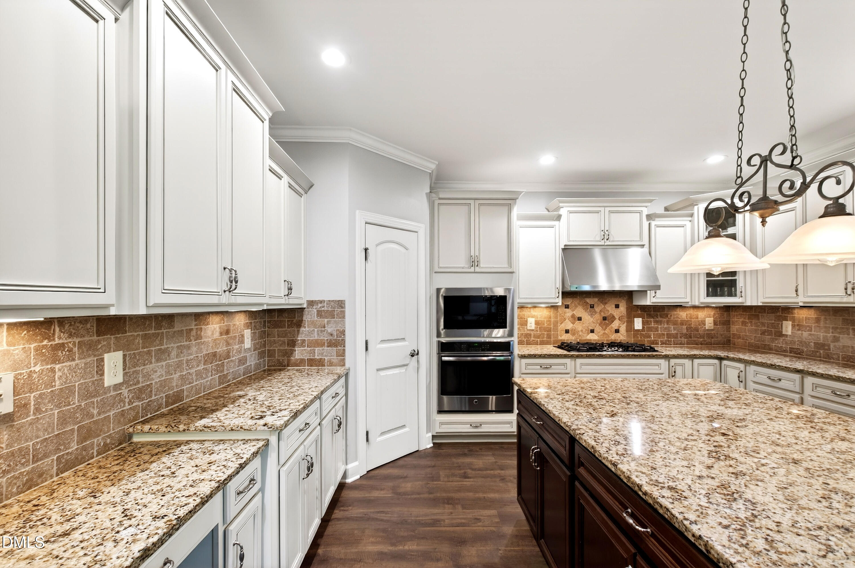 313 Karpen Lane Cary, NC 27519 - Photo 27 of 86 a kitchen with stainless steel appliances granite countertop a sink stove and refrigerator