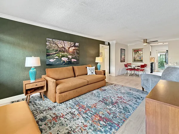 a living room with furniture and a rug