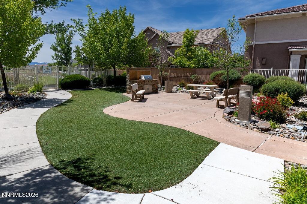 1864 Wind Ranch Road, Unit B Reno, NV 89521 - Photo 37 of 42 a view of a backyard with sitting area