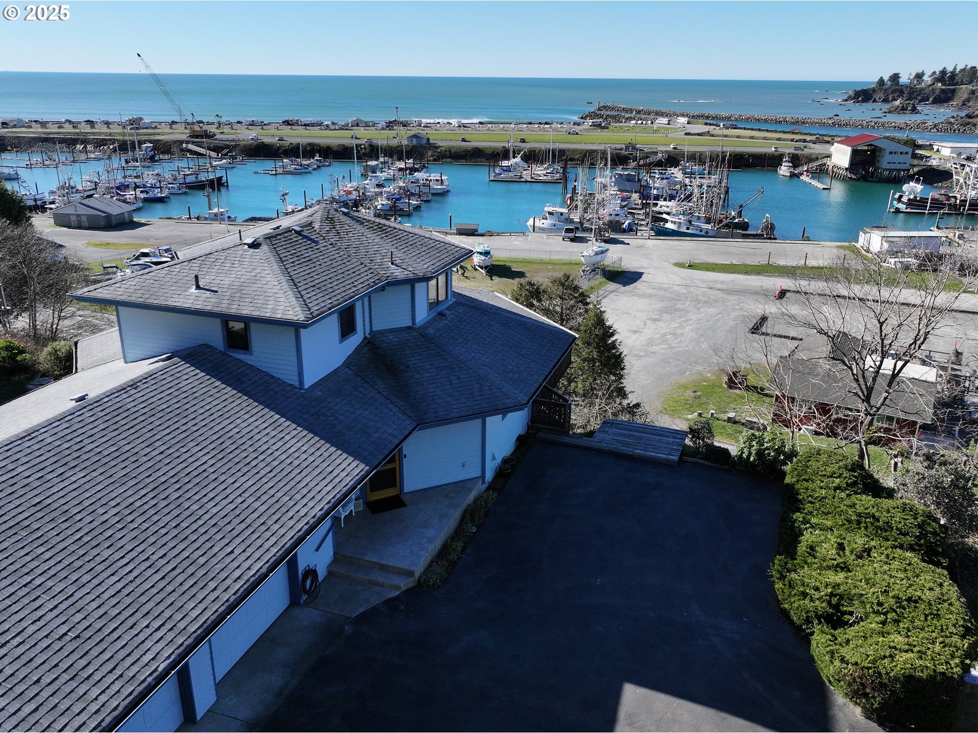 16151 Lower Harbor Road Brookings, OR 97415 - Photo 1 of 43 an aerial view of a rooftop deck with outdoor seating