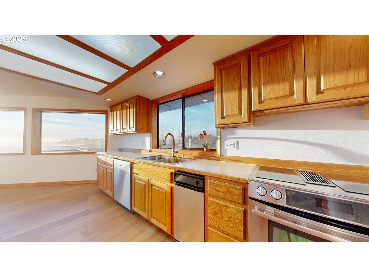 16151 Lower Harbor Road Brookings, OR 97415 - Photo 13 of 43 a kitchen with stainless steel appliances granite countertop a sink and cabinets