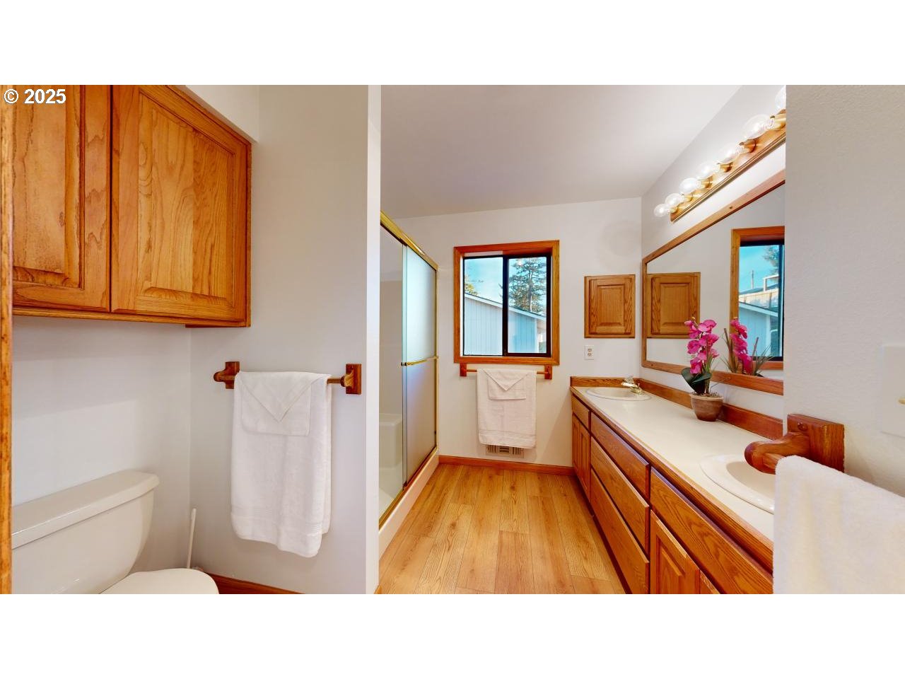 16151 Lower Harbor Road Brookings, OR 97415 - Photo 23 of 43 a bathroom with a sink toilet and mirror