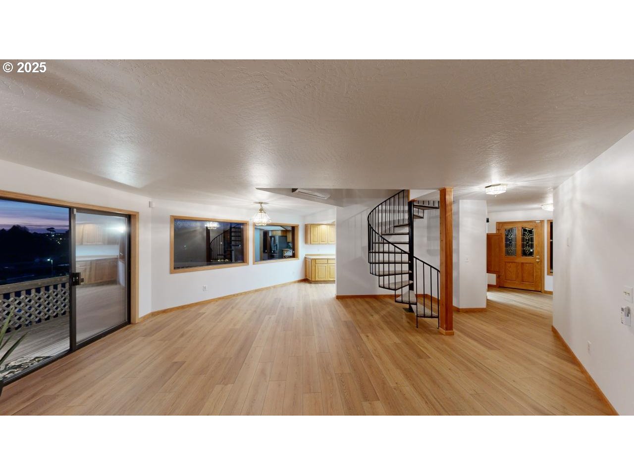 16151 Lower Harbor Road Brookings, OR 97415 - Photo 10 of 43 a open hall with a chair and potted plant in front of it
