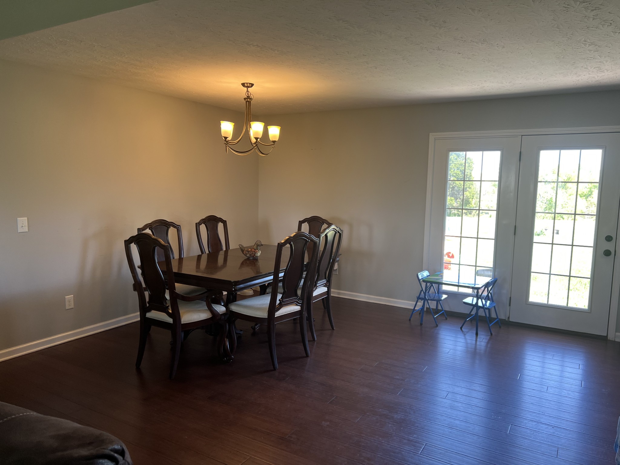 1288 Mt Olive Road Westmoreland, TN 37186 - Photo 5 of 16 a view of a dining room with furniture and wooden floor