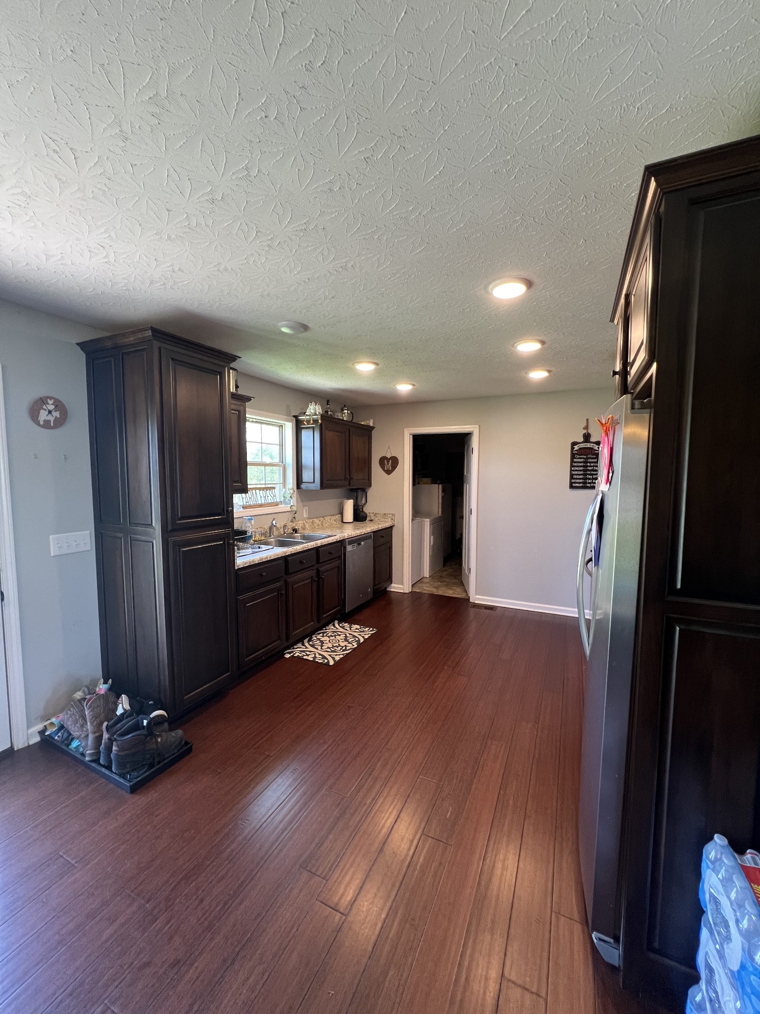 1288 Mt Olive Road Westmoreland, TN 37186 - Photo 7 of 16 a view of kitchen with refrigerator stove and wooden floor