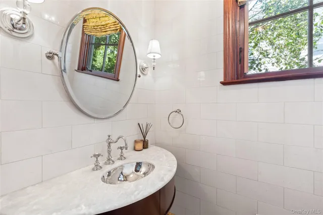a bed sitting in a bedroom next to a large window