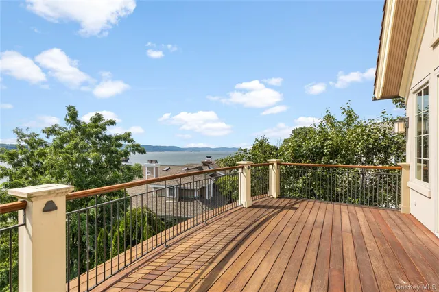 a spacious bathroom with a tub sink and mirror