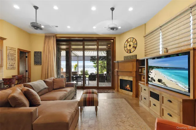 a bedroom with furniture and a fireplace