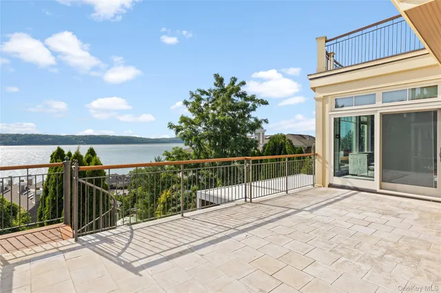 a view of a house with backyard and deck