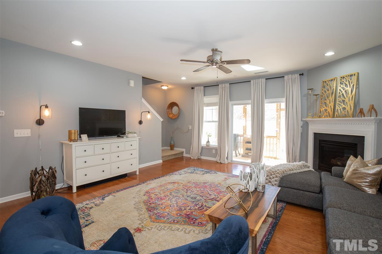 2441 Memory Ridge Drive Raleigh, NC 27606 - Photo 1 of 21 a living room with furniture a flat screen tv and a fireplace