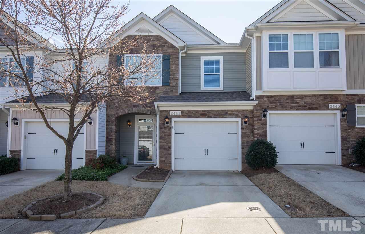 2441 Memory Ridge Drive Raleigh, NC 27606 - Photo 2 of 21 a front view of a house with a yard and garage