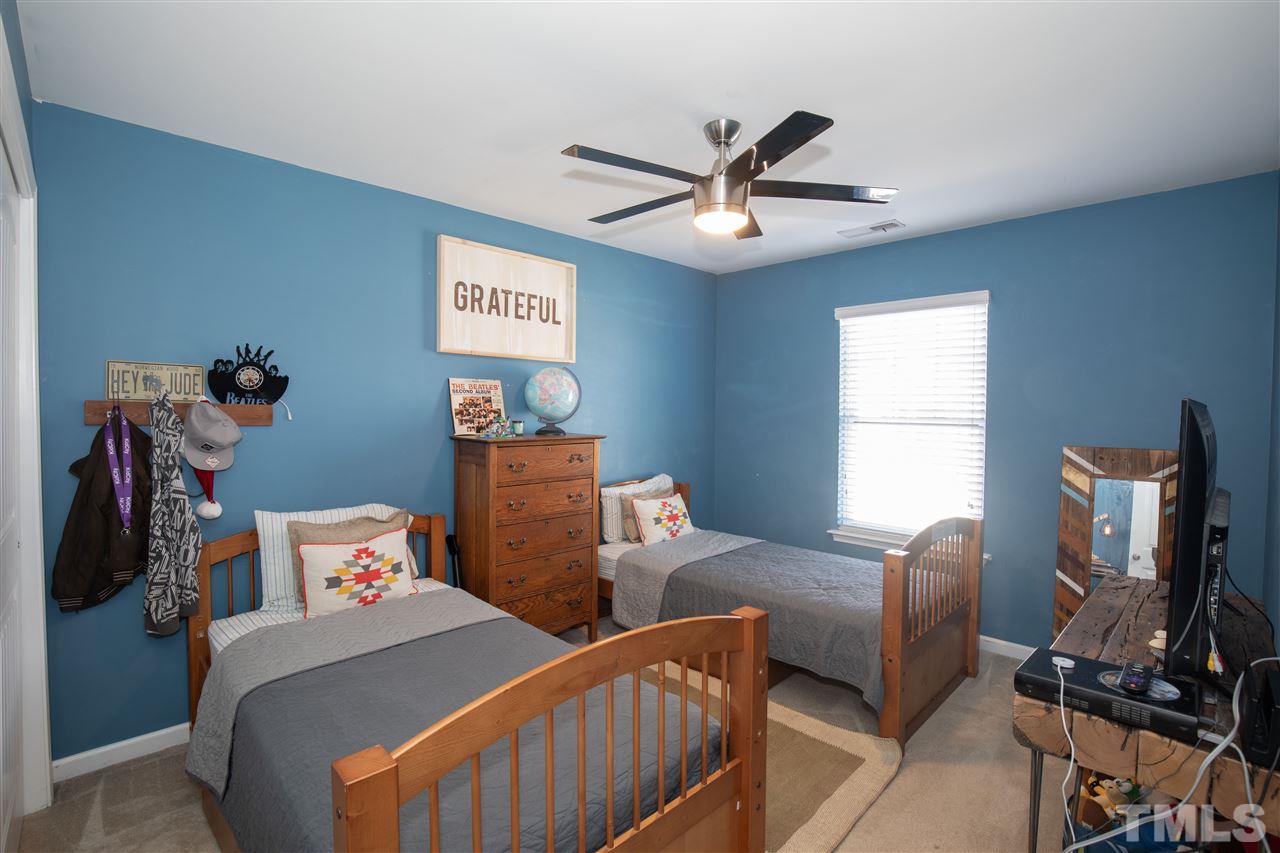 2441 Memory Ridge Drive Raleigh, NC 27606 - Photo 12 of 21 a bedroom with furniture and a window