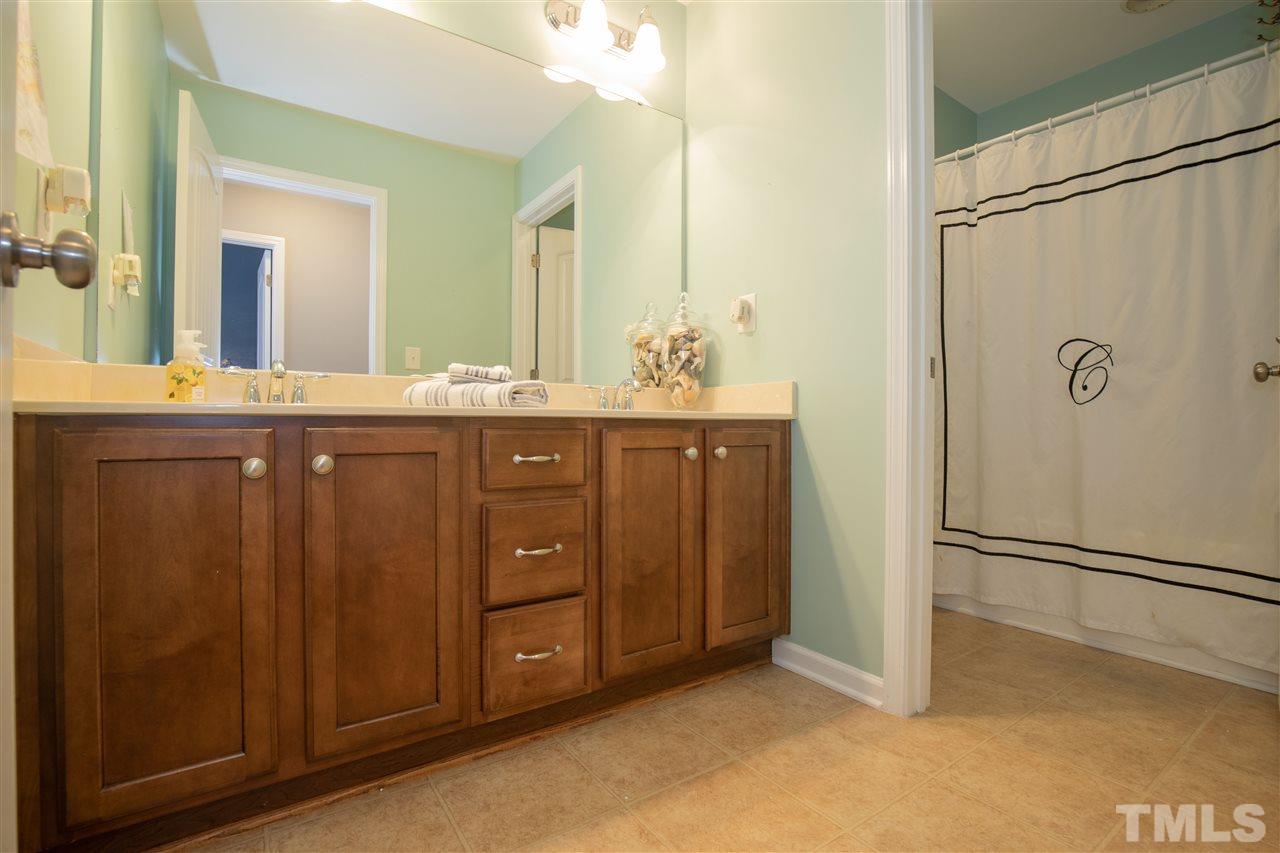 2441 Memory Ridge Drive Raleigh, NC 27606 - Photo 15 of 21 a spacious bathroom with a granite countertop sink mirror and double