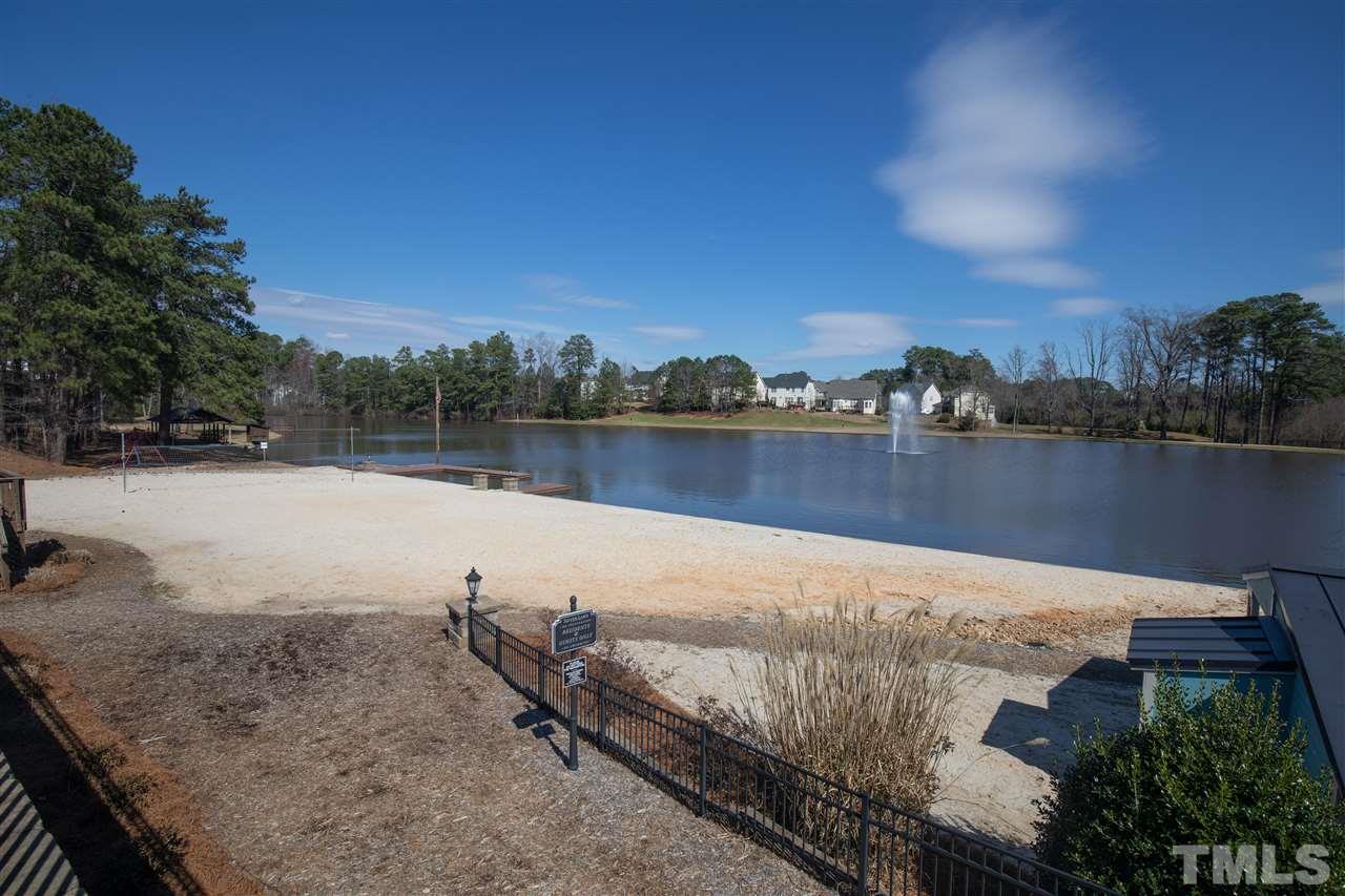 2441 Memory Ridge Drive Raleigh, NC 27606 - Photo 17 of 21 a view of a lake with houses in the back