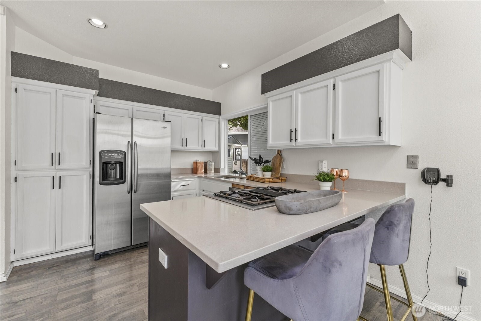 1027 Southwest 352nd Street Federal Way, WA 98023 - Photo 11 of 33 a kitchen with refrigerator and white cabinets