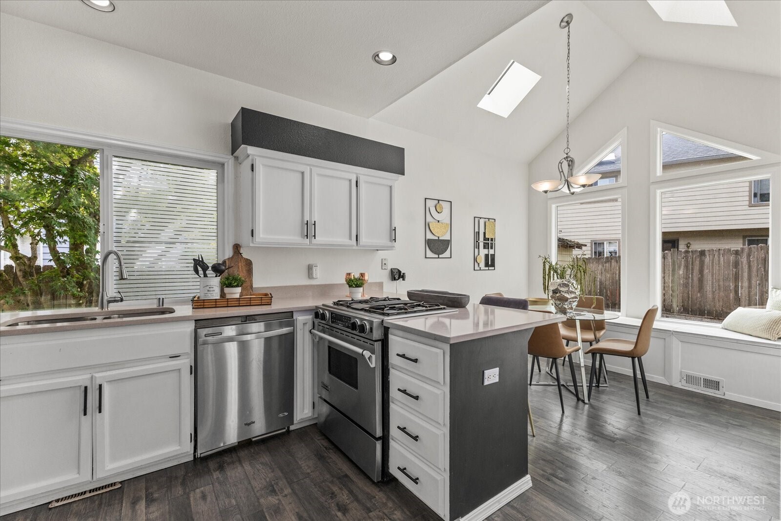 1027 Southwest 352nd Street Federal Way, WA 98023 - Photo 12 of 33 a kitchen with a stove top oven sink and cabinets
