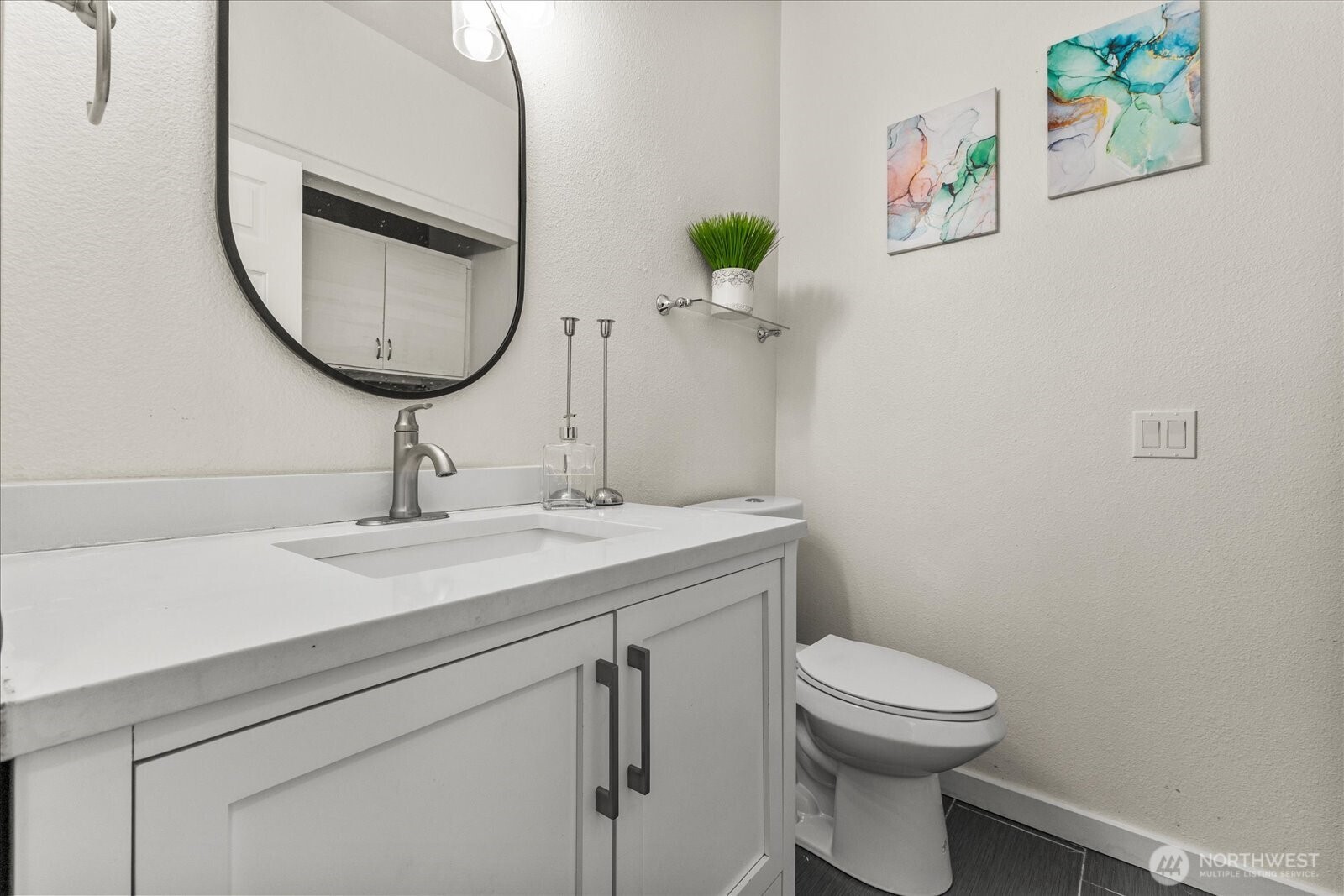 1027 Southwest 352nd Street Federal Way, WA 98023 - Photo 15 of 33 a bathroom with a toilet a sink and mirror