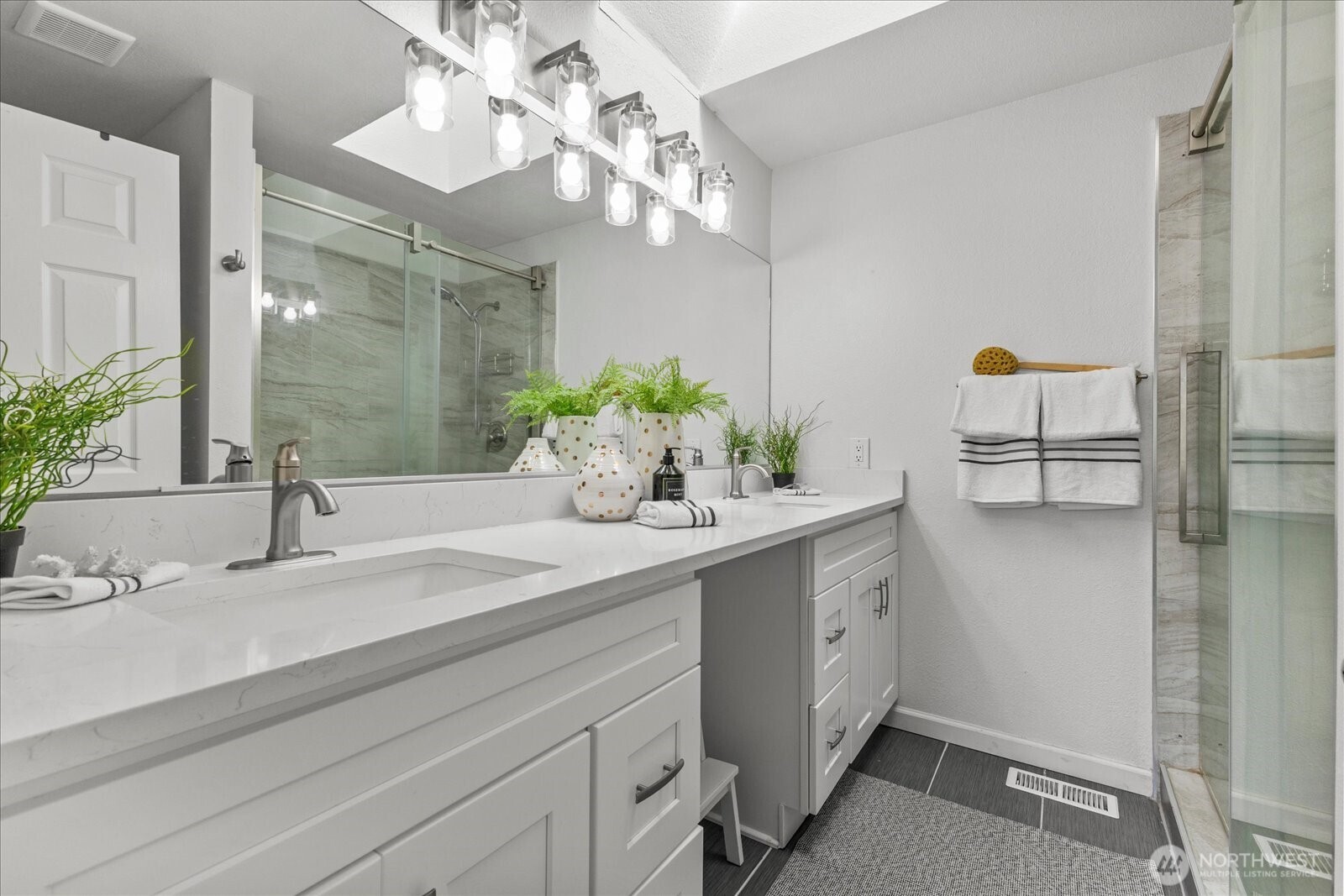 1027 Southwest 352nd Street Federal Way, WA 98023 - Photo 19 of 33 a bathroom with a sink and a mirror