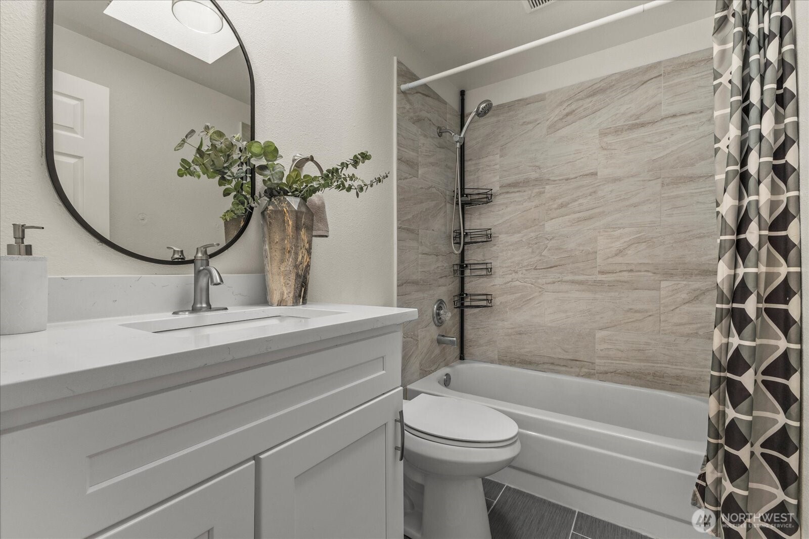 1027 Southwest 352nd Street Federal Way, WA 98023 - Photo 23 of 33 a bathroom with a granite countertop toilet a sink and bathtub