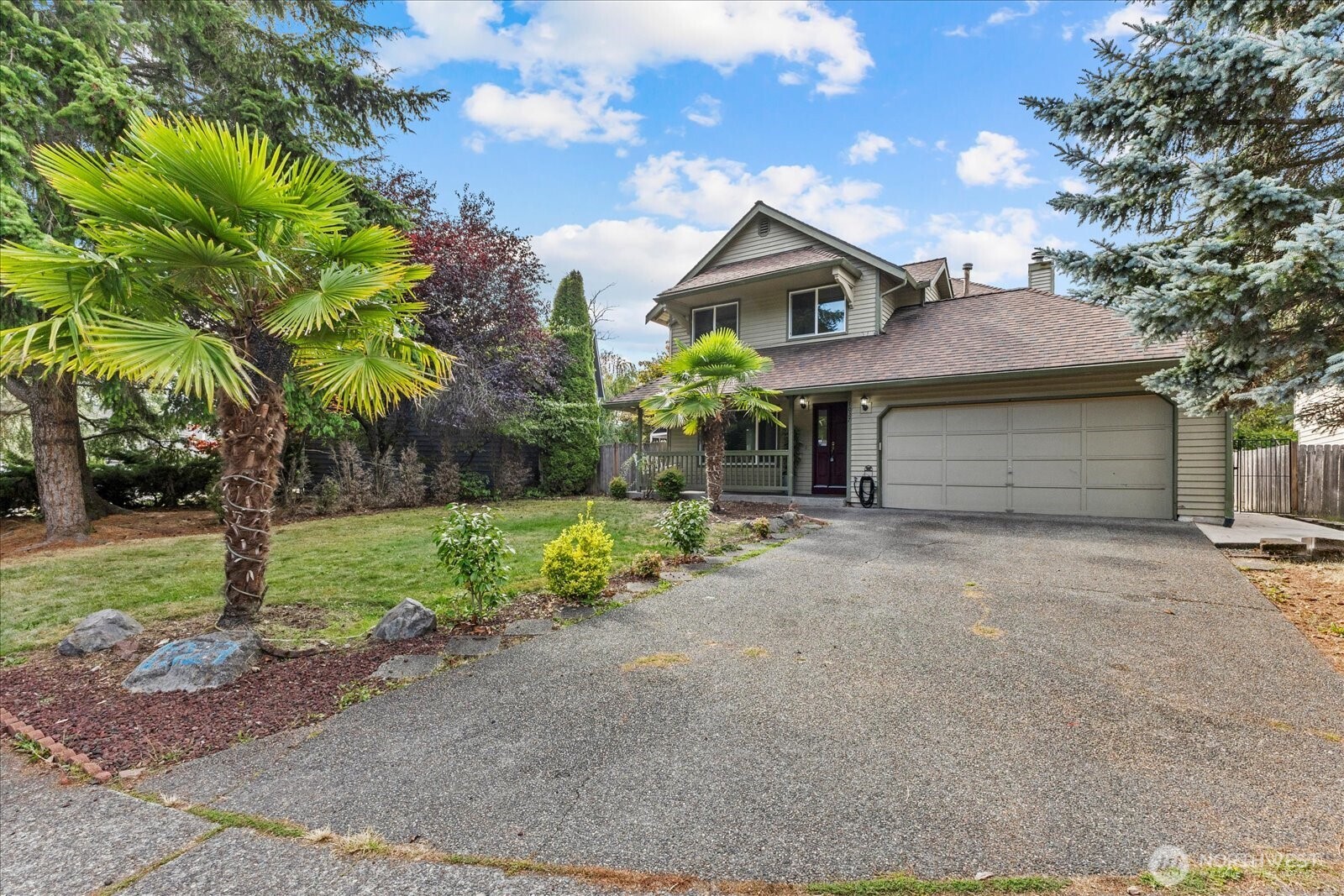 1027 Southwest 352nd Street Federal Way, WA 98023 - Photo 32 of 33 a front view of a house with a yard and garage