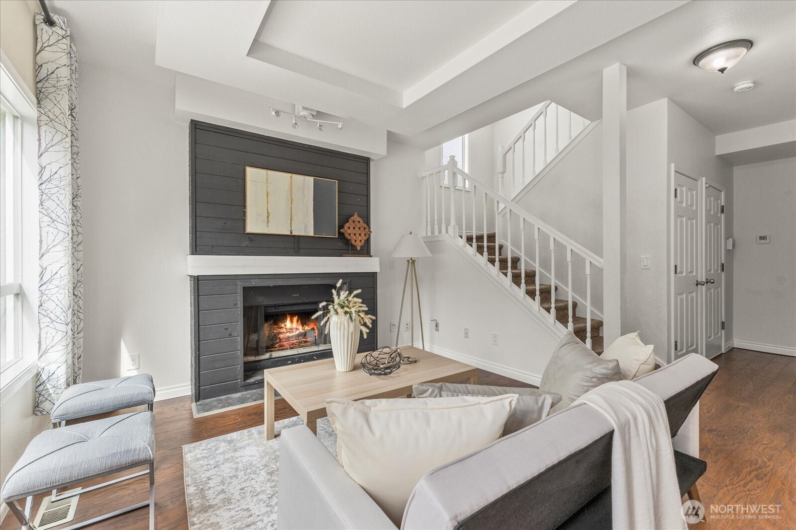 1027 Southwest 352nd Street Federal Way, WA 98023 - Photo 9 of 33 a living room with a fireplace and a large window