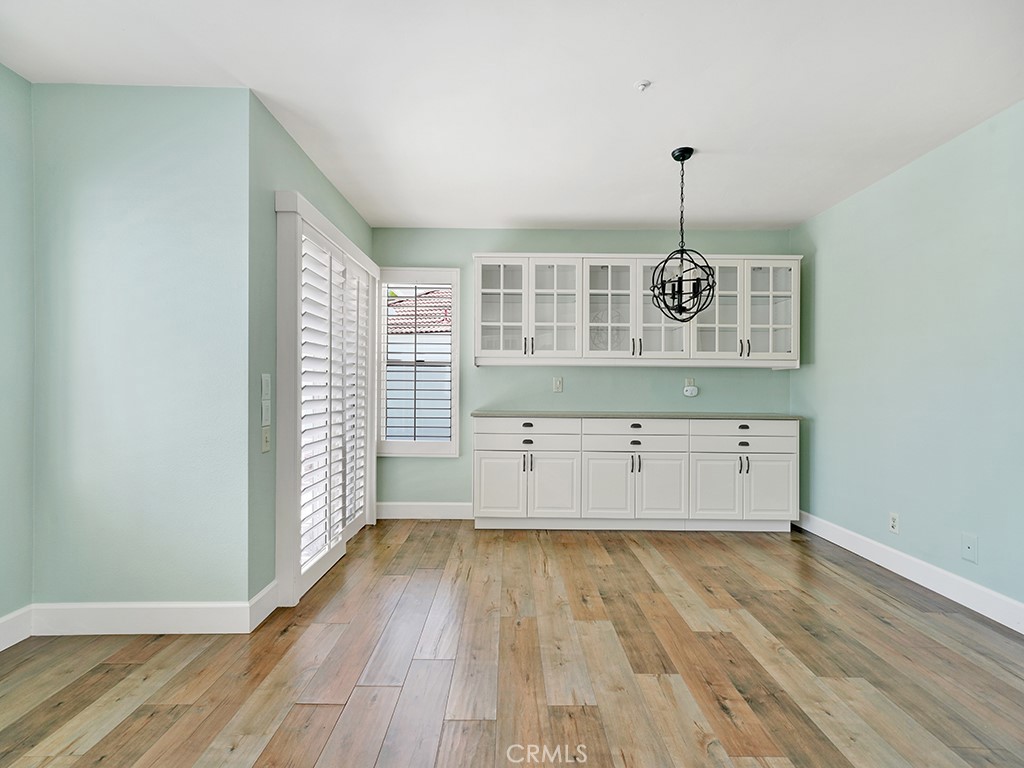 604 Via Espiritu San Clemente, CA 92672 - Photo 14 of 50 a view of empty room with wooden floor and fan