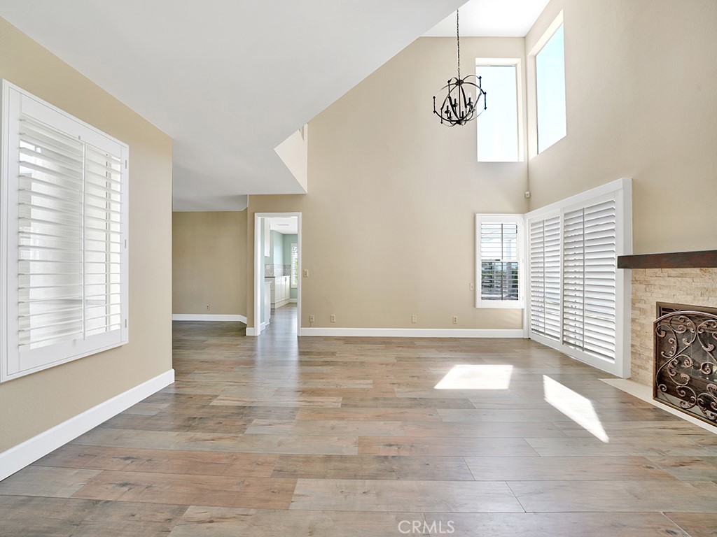 604 Via Espiritu San Clemente, CA 92672 - Photo 29 of 50 a view of an empty room with wooden floor and a window