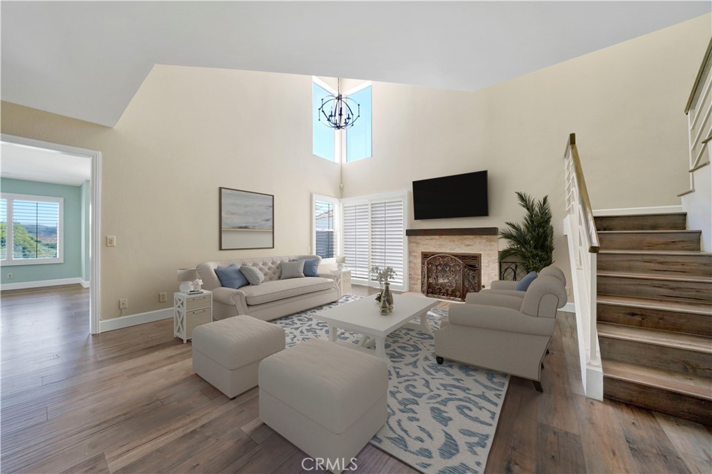 604 Via Espiritu San Clemente, CA 92672 - Photo 3 of 50 a living room with furniture a fireplace and a flat screen tv