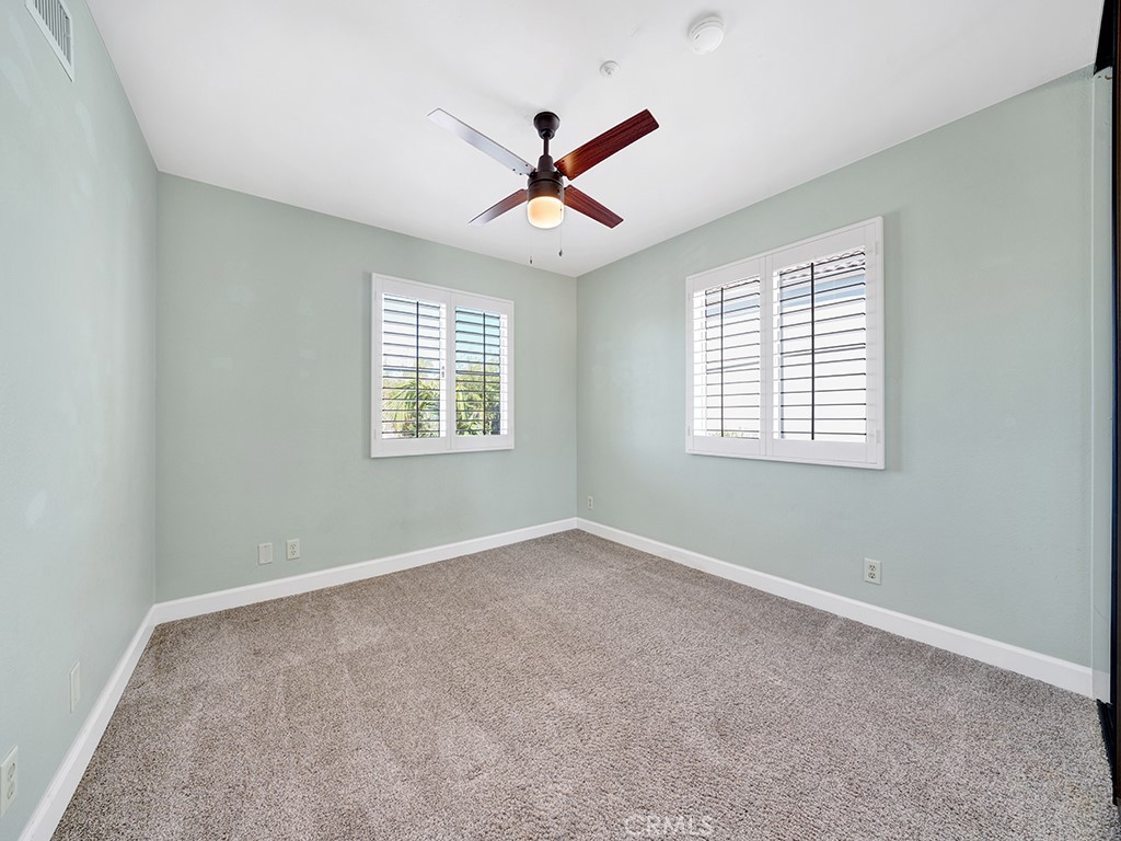 604 Via Espiritu San Clemente, CA 92672 - Photo 32 of 50 an empty room with ceiling fan and windows