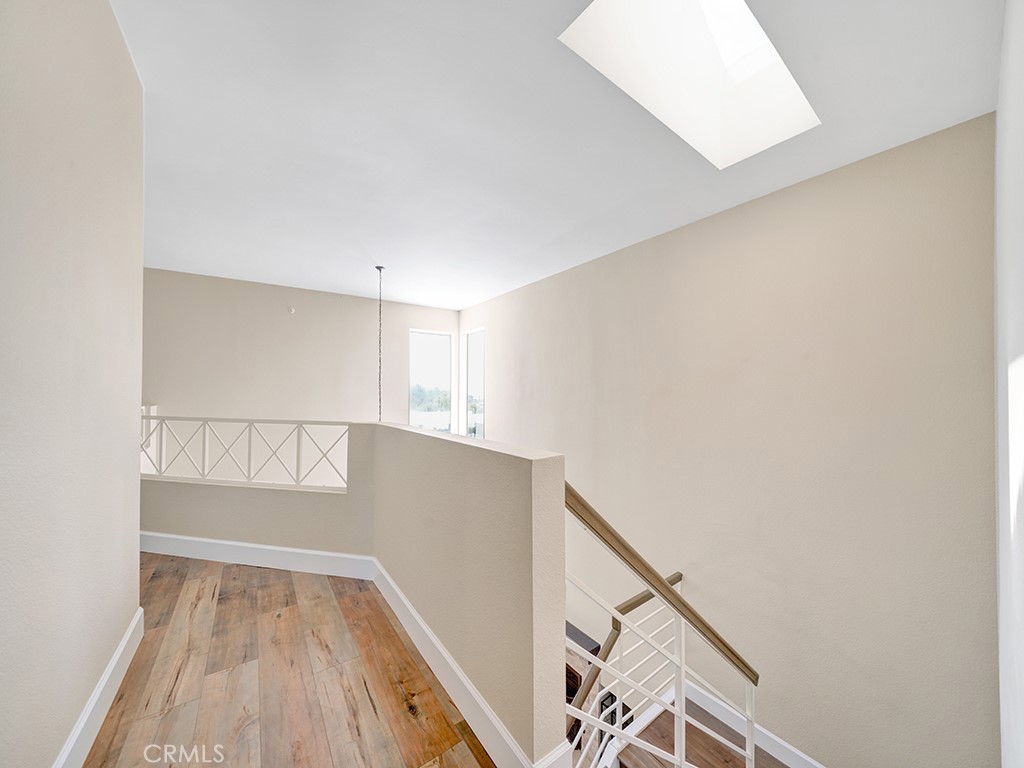 604 Via Espiritu San Clemente, CA 92672 - Photo 34 of 50 a view of an empty room with wooden floor and a window