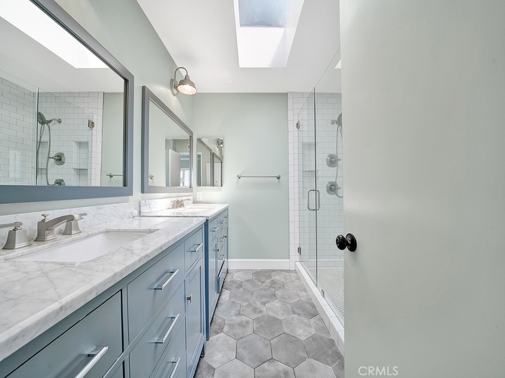 604 Via Espiritu San Clemente, CA 92672 - Photo 42 of 50 a bathroom with a granite countertop sink mirror and double